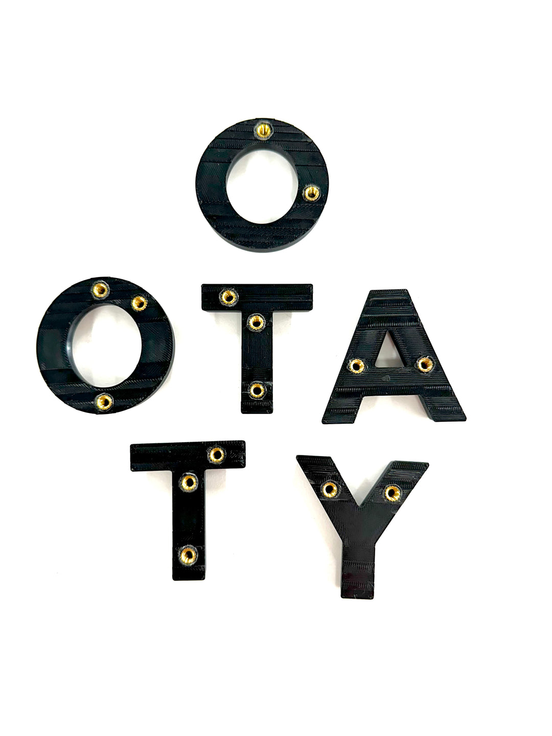 BPF 2024+ TRD PRO & Trailhunter Grille Letters spelling "OTATY" in black with brass-colored rivets, designed for CNC fabrication and heavy-duty overlanding gear customization.