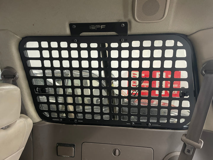 BPF 1990-1997 Toyota Land Cruiser Storage Panels installed inside the vehicle, featuring durable black grid design for efficient storage and organization.