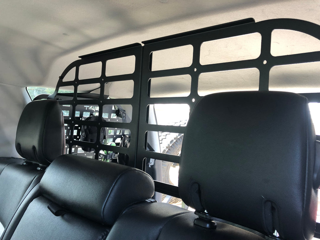 BPF Molle Style Pet Barrier 5th Gen Toyota 4Runner 2010-2024 installed behind rear seats, featuring CNC fabricated black metal mesh panel designed to keep pets secure inside the vehicle.